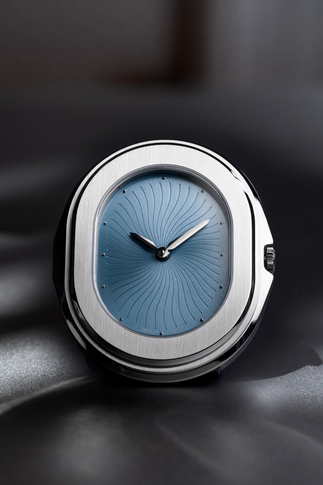 The Serica Parade Bleu Glacier seen face-on, its blue dial scored with curved lines